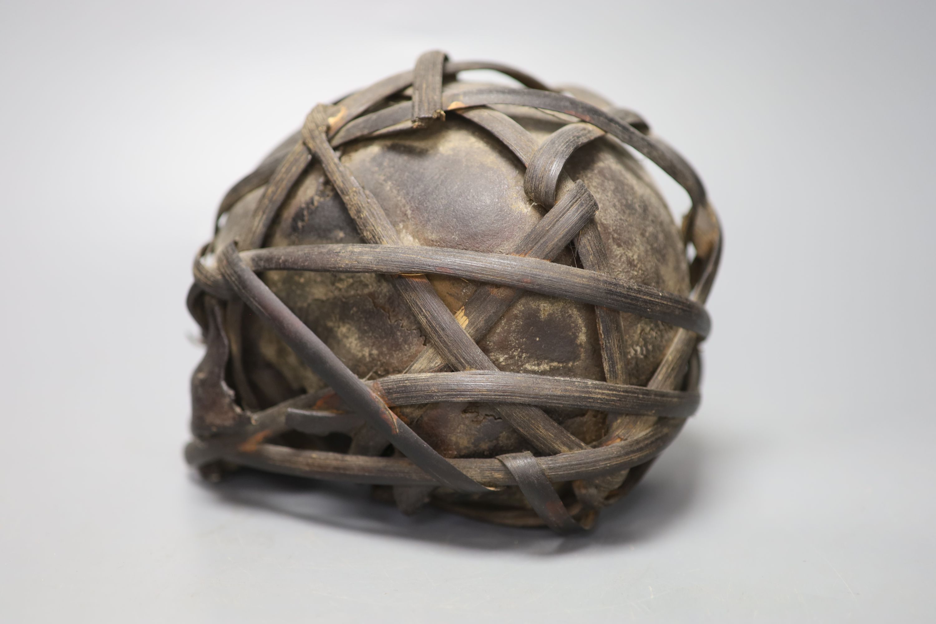 A bound Asmat human skull, possibly head hunters